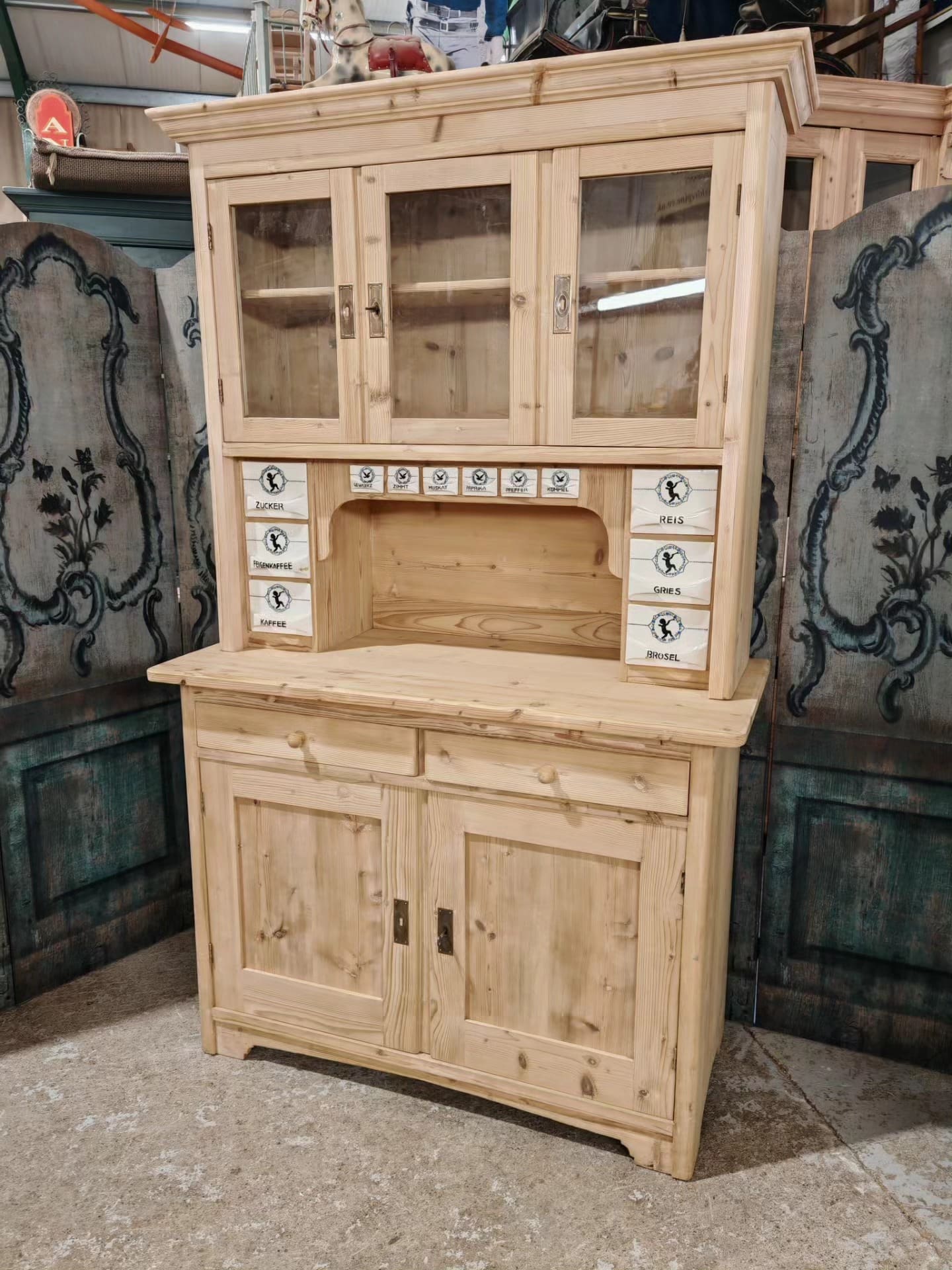 Antique German dresser with porcelain spice drawers