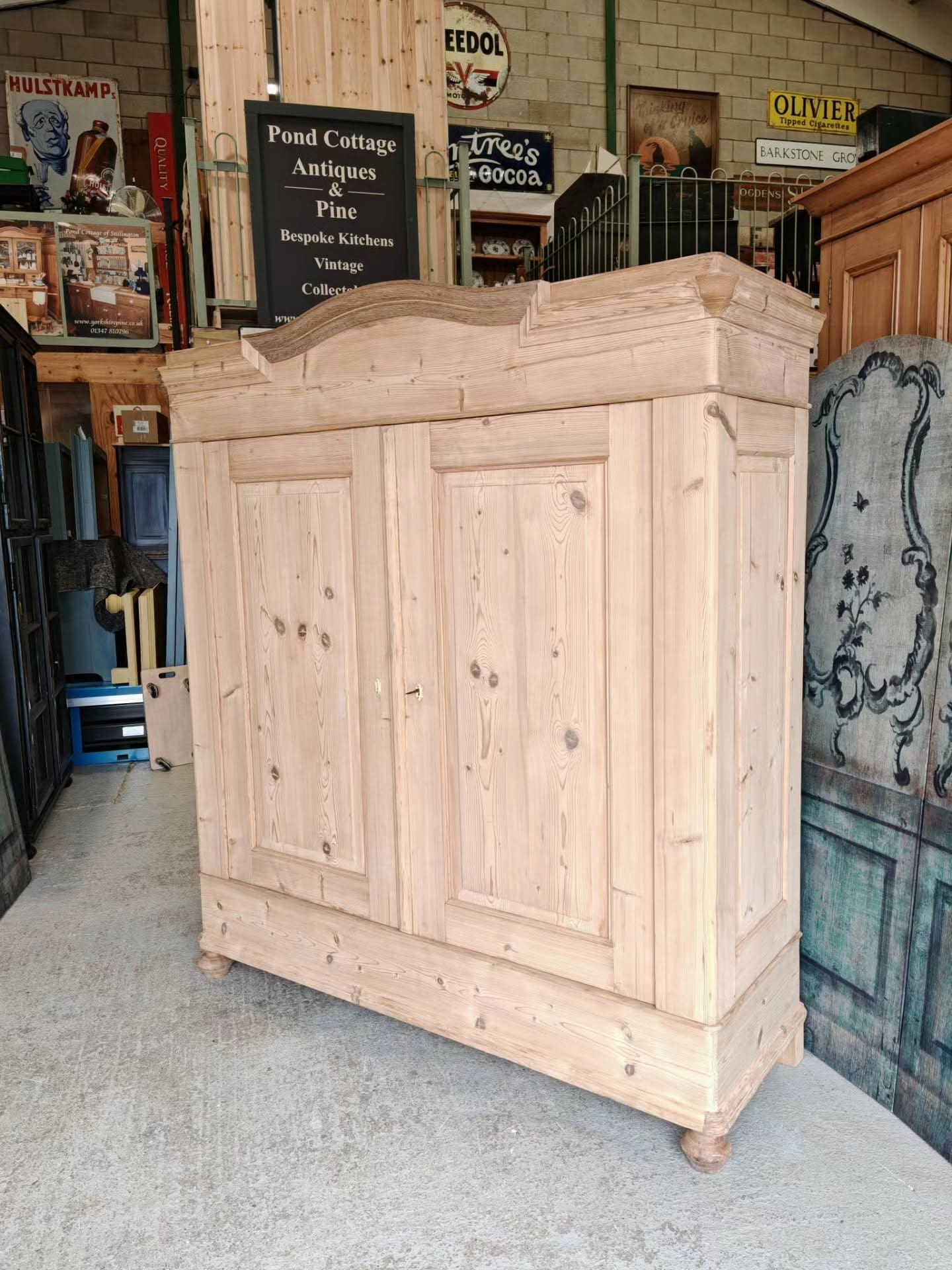 Large German wardrobe with arch cornice detailing